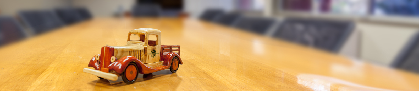 Small toy car on a desk.